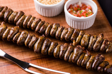 Grilled Chicken Heart on Wooden Board with Dipping Sauces