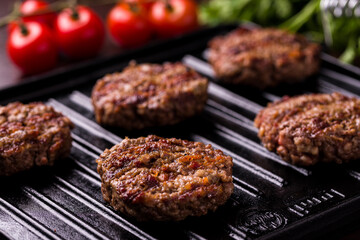 Juicy Grilled Beef Patties on a Cast Iron Grill Pan