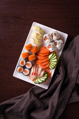 Fresh Sushi Platter with Assorted Rolls and Sashimi on Plate