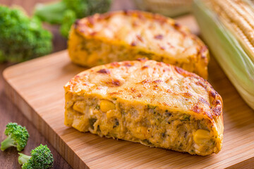 Delicious Corn and Cheese Pie on Wooden Board