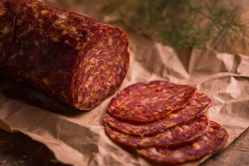 Traditional Spicy Salami on Rustic Paper Background