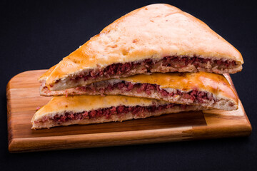 Delicious Stuffed Bread Slices on Cutting Board