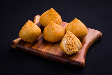 Delicious Brazilian Coxinha Snacks on Wooden Board