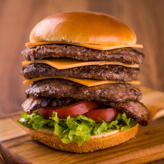 Delicious Towering Cheeseburger With Layers of Meat and Cheese