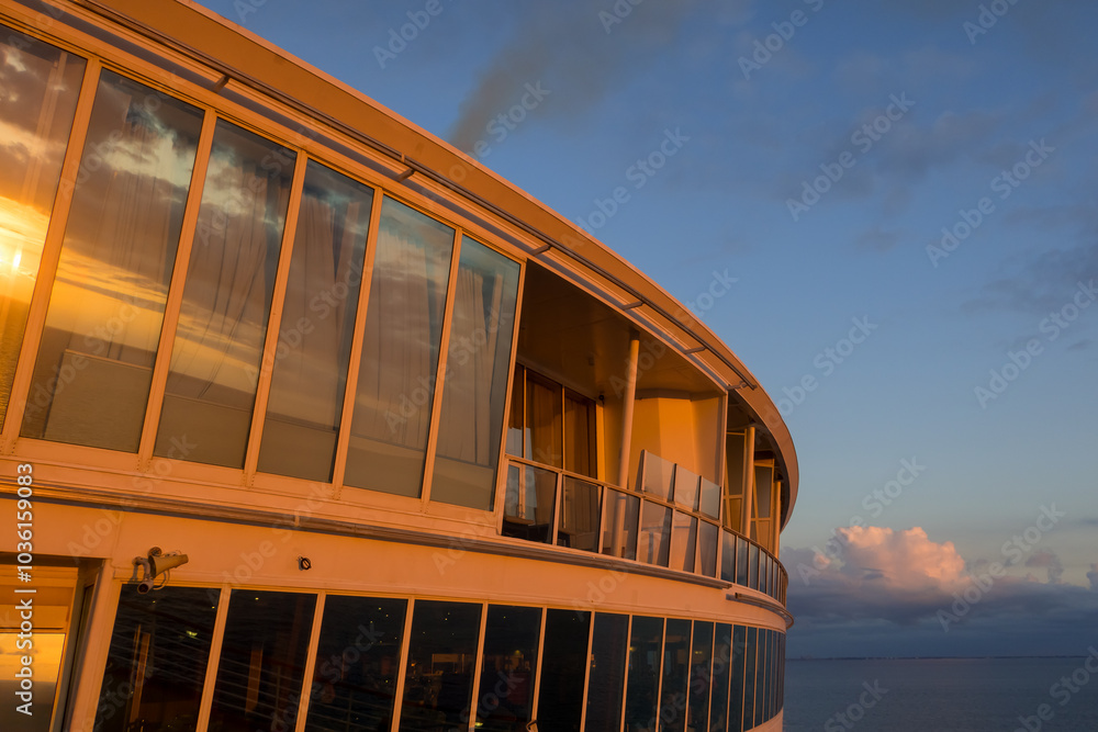 Wall mural front deck of the cruise liner under evening sun light.