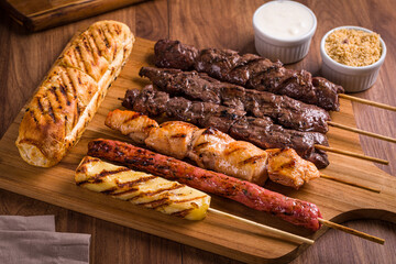 Delicious Grilled Meat and Bread Skewers on Wooden Platter