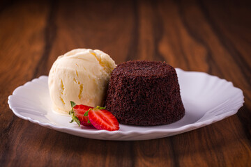 Decadent Petit Gateau Chocolate Cake with Vanilla Ice Cream and Strawberries