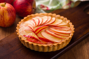 Delicious Homemade Apple Tart on a Rustic Wooden Board