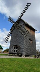 Traditional wooden old windmill, summer landscape