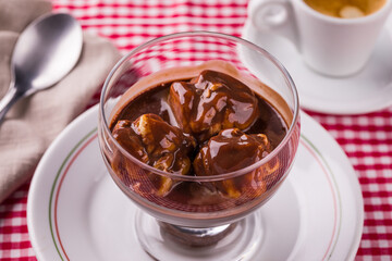 Delicious Éclair Chocolate Dessert on a Red Checkered Tablecloth