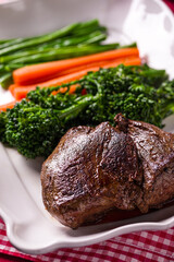Delicious Grilled Steak Served With Fresh Carrots And Broccoli