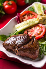 Delicious Grilled Beef Steak with Fresh Salad on Ceramic Plate