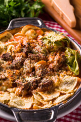 Close-Up of Delicious Baked Pasta Dish With Cheese and Herbs