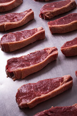 Fresh Raw Chorizo Beef Steaks Arranged on a Steel Surface for Cooking