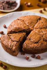 Delicious Hazelnut Cake on White Plate with Chocolate Garnish