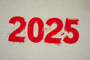 2025 written in red paint on the wall