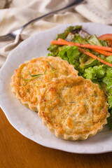 Delicious Quiches Served With Fresh Garden Salad On White Plate