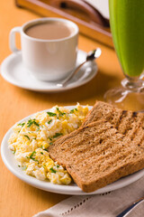Delicious Breakfast Plate with Coffee and Green Smoothie on a Table