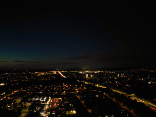 Obraz premium Aerial View of Illuminated Luton City of England UK at Just After Sunset and Full Moon Night. Aerial Footage Was Captured with Drone's Camera on October 17th, 2024