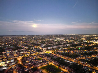 Obraz premium Aerial View of Illuminated Luton City of England UK at Just After Sunset and Full Moon Night. Aerial Footage Was Captured with Drone's Camera on October 17th, 2024