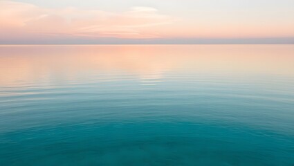 Obraz premium The calm sea has crystal clear blue water that reflects the sky, conveying inner peace and tranquility.