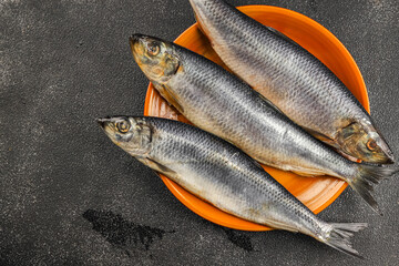 Herring fresh fish seafood pescetarianism tasty food dish fresh delicious gourmet food background on the table rustic food top view copy space top view keto and paleo diet vegetarian