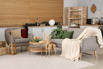Interior of festive open space kitchen with Christmas decorations