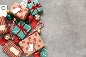 Composition with beautiful Christmas gifts, decorations and cookies on grunge background