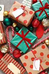 Composition with beautiful Christmas gifts, decorations and cookies on grunge background