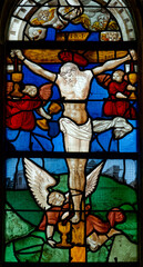 2024-10-15, Collomiers, FRANCE. Stained glass (18th century) of Jesus Christ crucified on the cross.