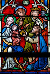 Obraz premium 2024-10-16, Auxerre, FRANCE. Stained glass (17th century) of Christmas Nativity Scene : Adoration of the Magi as they present gifts of gold, frankincense and myrrh to the Infant Jesus.