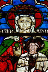 2024-10-16, Auxerre, FRANCE. Stained glass (17th century) of Blessed Virgin Mary holding baby Jesus...