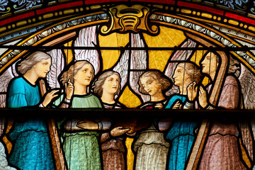2024-10-16, Avallon, FRANCE. Stained (19th century) glass of a choir of angels singing. .
