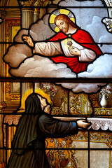2024-10-16, Avallon, FRANCE. Stained glass (19th century) of Vision of Sacred Heart of Jesus Christ to Saint Margaret Mary Alacoque or Sainte Marguerite Marie Alacoque.. © Joan
