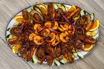 Overhead view of delicious looking shellfish dish full of shrimp, crawfish, and mussels for an excellent Mexcian seafood meal
