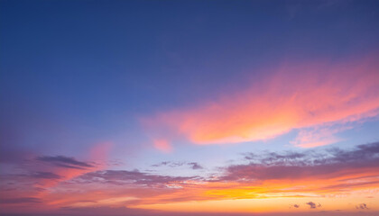 Fototapeta premium Breathtaking sunset sky with a gradient of orange, pink, and blue hues. Background photos for banners, posters and wallpapers.