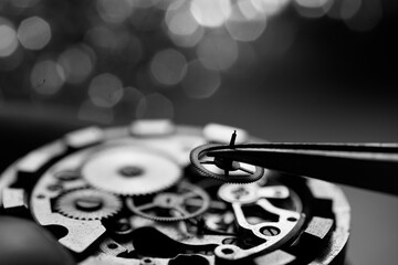 Watchmaker is repairing the mechanical watches in his workshop