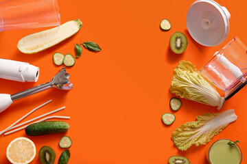 Modern blender with glass of smoothie, fruits and vegetables on orange background