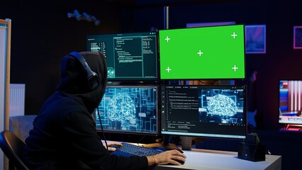 Cybercriminal using AI machine learning and isolated screen PC to develop system exploits. Hacker...