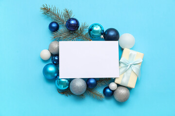 Blank card and Christmas decor on blue background