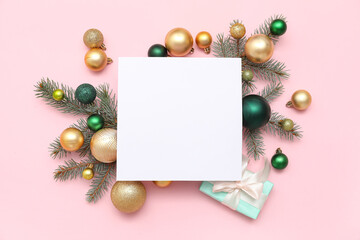 Blank card, Christmas balls, gift box and fir branches on pink background
