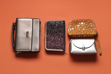 Different stylish bags on color background