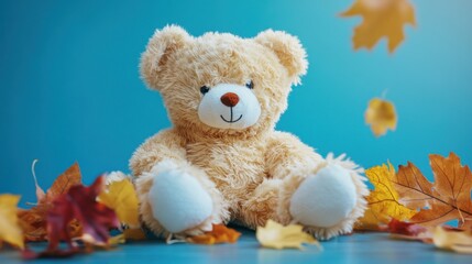 Teddy Bear Sitting With Fall Leaves