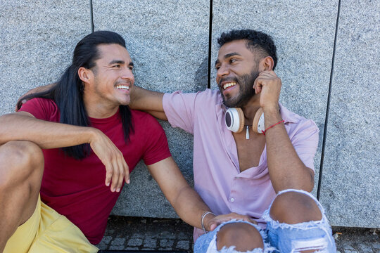 Gay couple enjoying a joyful moment together in the city - Powered by Adobe