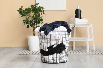 Basket full of dirty clothes in laundry room