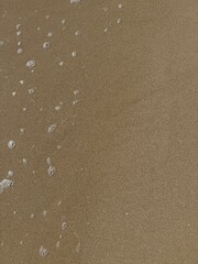 texture of sand with drop of water
