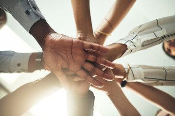 Below, stack and hands of business people in office for teamwork, collaboration and support. Professional, corporate staff and men and women with gesture for solidarity, partnership and agreement