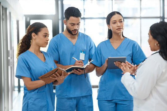 Doctors, tablet and people with discussion in hospital for healthcare schedule, planning surgery and feedback. Woman, teamwork and digital research of medical advice, checklist and report information