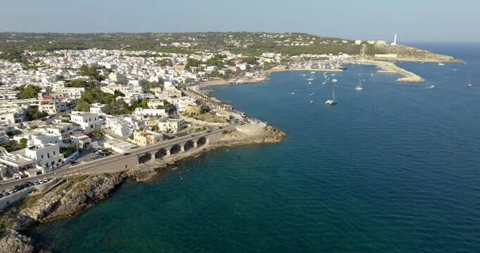 Aerial view of Santa Maria di Leuca in Salento, Puglia, Italy. It is a hamlet of Castrignano del Capo in the province of Lecce that overlooks the Mediterranean Sea. In the background the lighthouse.