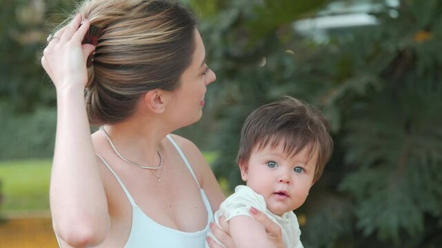 Caucasian mom and son hanging out at park